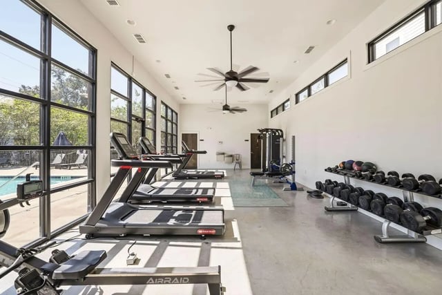 Treadmills rowing machine dumbbell racks fitness room at The Highlands in Reno Student Accommodation