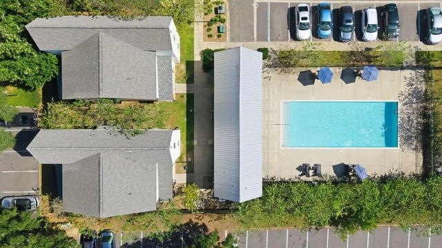 Aerial view of buildings pool parking lot exterior at The Highlands in Reno Student Accommodation