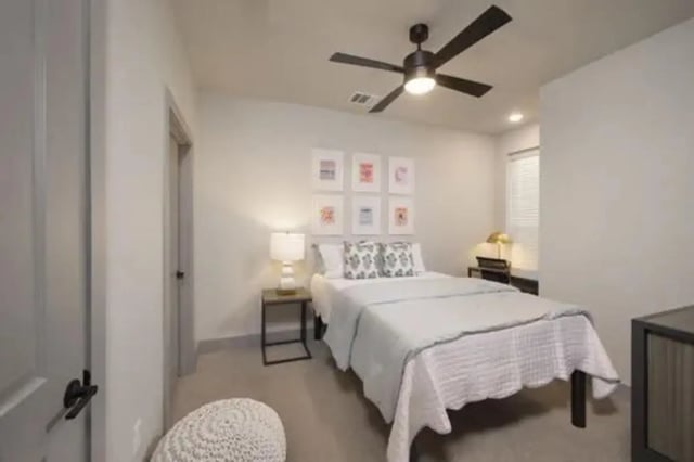 Bed fan pictures desk lamp white comforter bedroom at The Wyatt in Lexington Student Accommodation