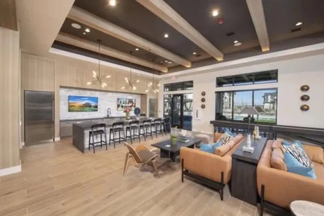 Kitchen island bar seating lounge area living room at The Wyatt in Lexington Student Accommodation