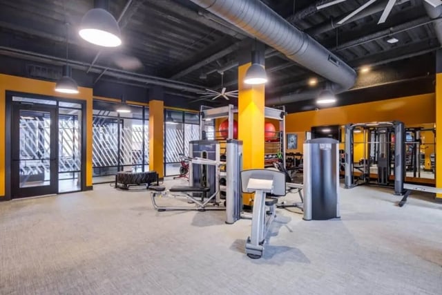 Gym equipment weights exercise machines fitness area gym at Proximity At 10th in Greenville Student Accommodation