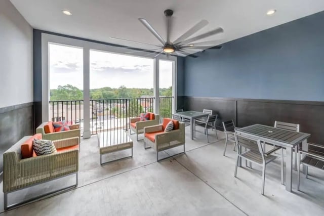 Outdoor seating and tables with ceiling fan living room at Proximity At 10th in Greenville Student Accommodation
