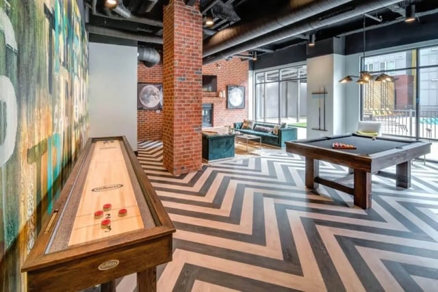 Shuffleboard pool table lounge living room at Proximity At 10th in Greenville Student Accommodation