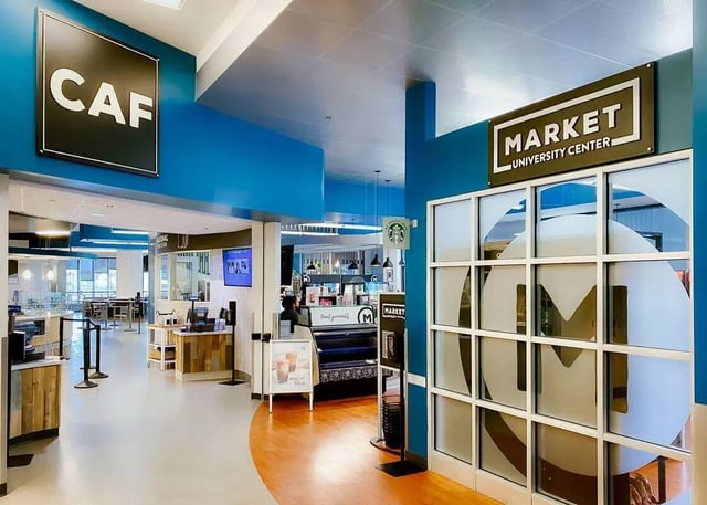 Cafeteria and market with seating area exterior at University Center in Chicago Student Accommodation