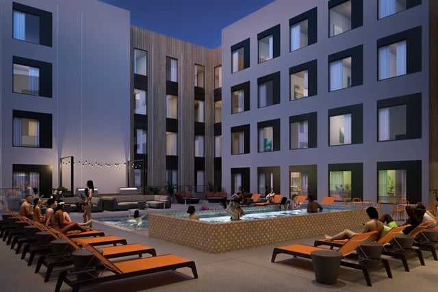 People relaxing by pool and lounge chairs courtyard at Villas Knoxville in Knoxville Student Accommodation
