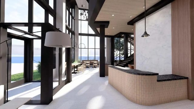 Reception desk with modern seating and large windows lobby at Villas Knoxville in Knoxville Student Accommodation