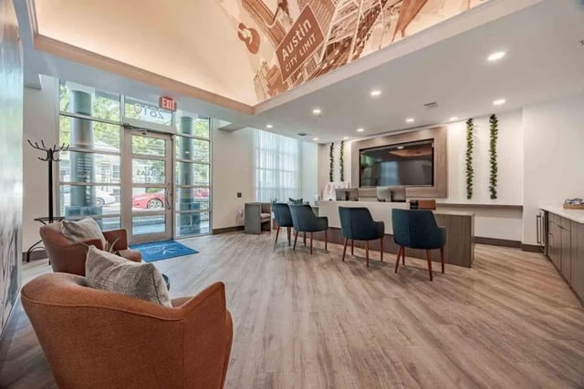 Lobby with seating and reception desk. at Villas On Guadalupe in Austin Student Accommodation