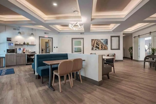 Seating area with booth seating and tables lounge area at Villas On Guadalupe in Austin Student Accommodation