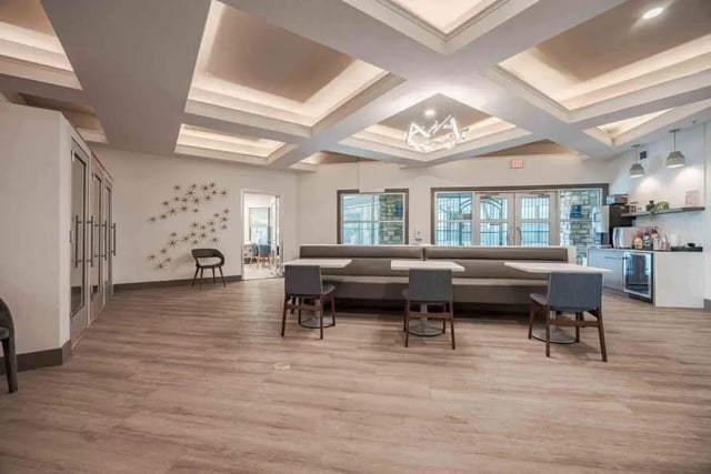 Banquette seating and tables communal kitchen area at Villas On Guadalupe in Austin Student Accommodation