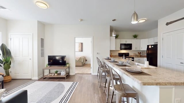 Counter with stools bedroom visible kitchen living room at The Hill at Rochester in Rochester Student Accommodation