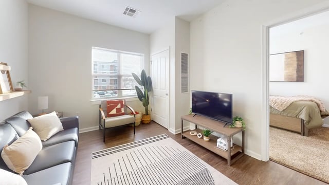 Sofa chair television and rug living room at The Hill at Rochester in Rochester Student Accommodation