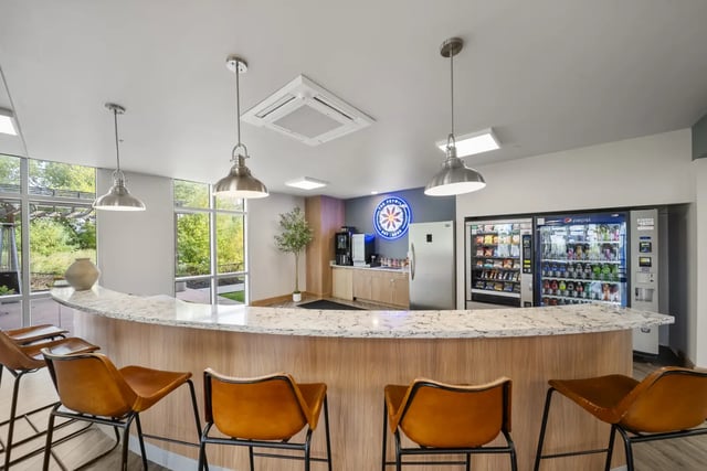 Bar with vending machines and seating area at The Hill at Rochester in Rochester Student Accommodation