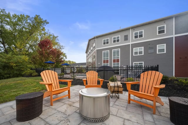 Adirondack chairs fire pit patio furniture exterior at The Hill at Rochester in Rochester Student Accommodation
