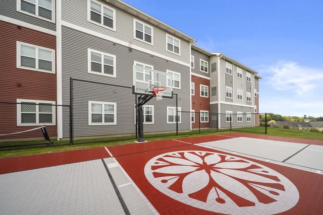 Basketball hoop and court exterior playing area at The Hill at Rochester in Rochester Student Accommodation