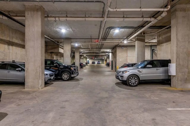Cars parked in an underground parking garage exterior at Villas on Rio in Austin Student Accommodation