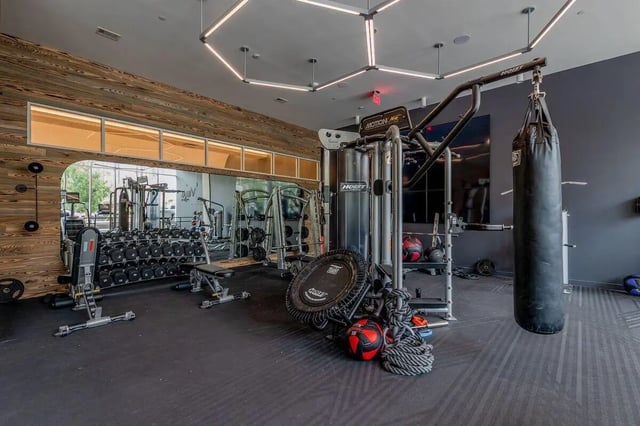 Weight racks punching bag and workout machines gym at Villas on Rio in Austin Student Accommodation