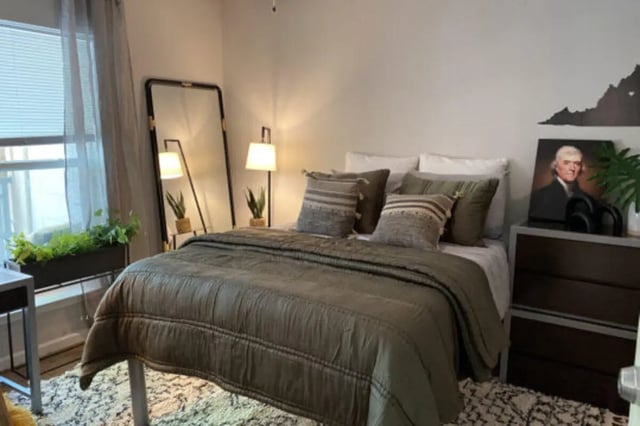 Bed dresser mirror and lamps Bedroom at The Pavilion at North Grounds Apartments in Charlottesville Student Accommodation