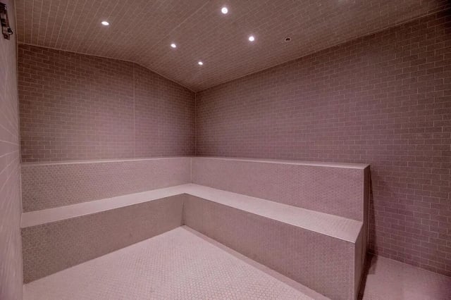 Tiled steam room with built in seating Steam room at Villas on Rio in Austin Student Accommodation