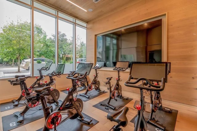 Peloton bikes with screens gym exercise room at Villas on Rio in Austin Student Accommodation