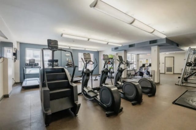 Gym equipment including stair climber ellipticals and treadmills gym at The Pavilion at North Grounds Apartments in Charlottesville Student Accommodation
