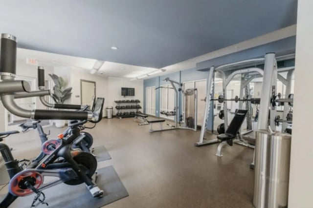 Exercise bikes weights machines gym area at The Pavilion at North Grounds Apartments in Charlottesville Student Accommodation