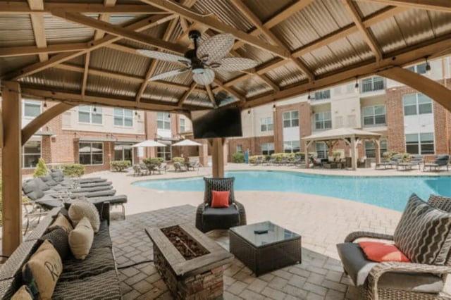 Gazebo with seating television and pool exterior at The Pavilion at North Grounds Apartments in Charlottesville Student Accommodation