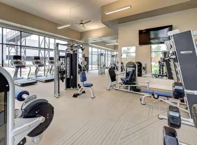 Treadmills weight machines and benches gym interior at The Lyndon in San Marcos Student Accommodation