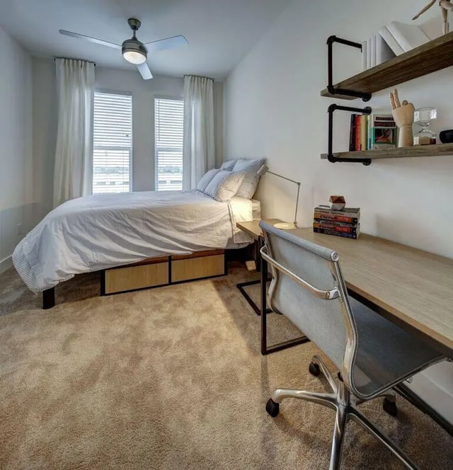 Bed desk chair shelving books bedroom at The Lyndon in San Marcos Student Accommodation