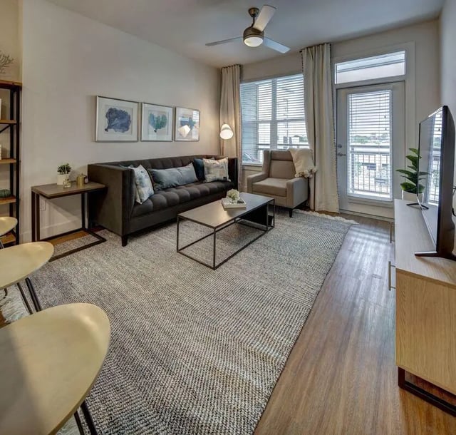 Sofa coffee table armchair rug living room at The Lyndon in San Marcos Student Accommodation