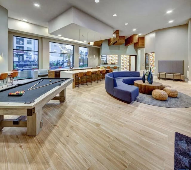 Pool table blue sofa lounge bar area living room at The Lyndon in San Marcos Student Accommodation