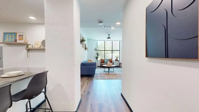 Blue couch and chairs in living room living room at The Hive in Atlanta Student Accommodation