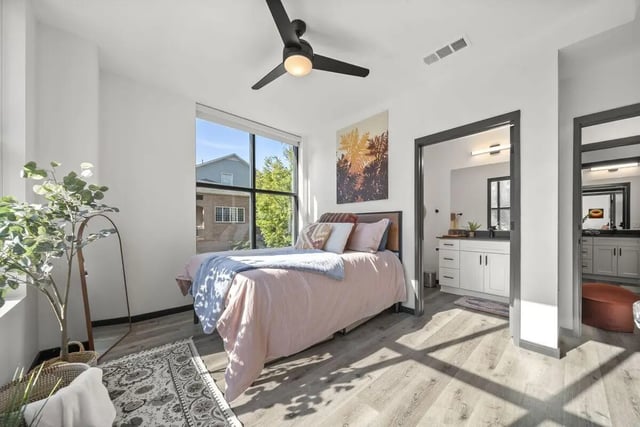 Bed fan plants rug open bathroom bedroom at The Hive in Atlanta Student Accommodation