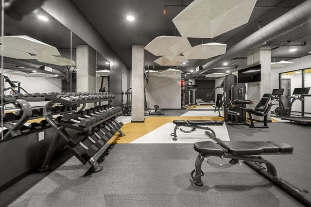 Dumbbells benches machines and treadmills gym area at The Hive in Atlanta Student Accommodation