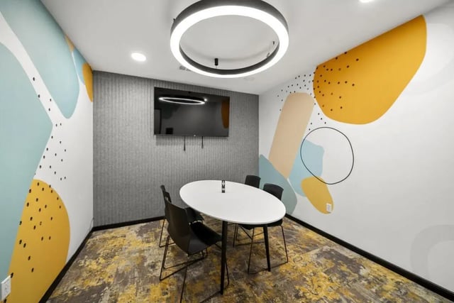 Oval table four chairs wall mounted TV study area at The Hive in Atlanta Student Accommodation