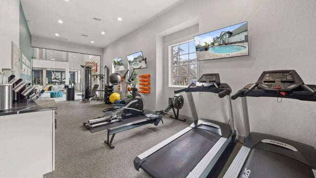 Gym equipment treadmills rowers ellipticals weight rack living area Image Type at Station 42 in Tampa Student Accommodation