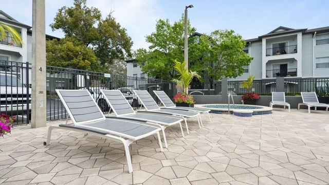 Lounge chairs near hot tub outdoor amenity area at Station 42 in Tampa Student Accommodation