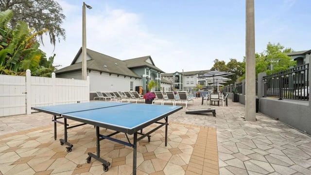 Ping pong table lounge chairs pool outdoor area at Station 42 in Tampa Student Accommodation