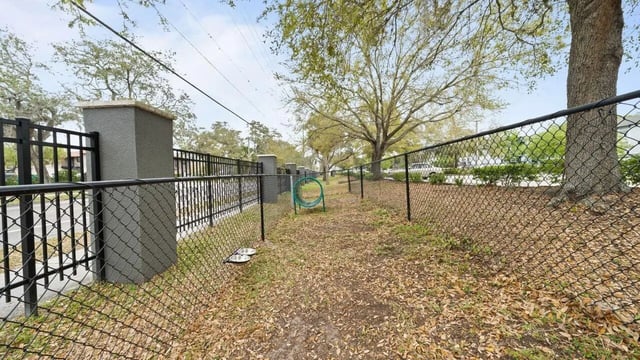 Dog agility tunnel water bowls dog park exterior at Station 42 in Tampa Student Accommodation