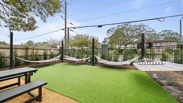 Hammocks picnic table on grass outdoor living area at Station 42 in Tampa Student Accommodation