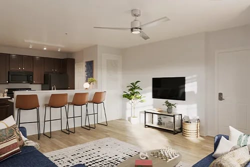 Bar stools kitchen island television living room at Latitude Lexington in Lexington Student Accommodation