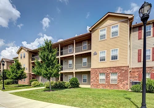 Apartment building with balconies and trees exterior at Latitude Lexington in Lexington Student Accommodation