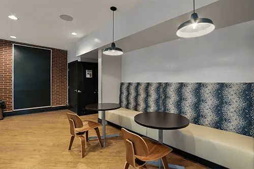 Chairs tables and booth seating area at Station at Five Points in Columbia Student Accommodation