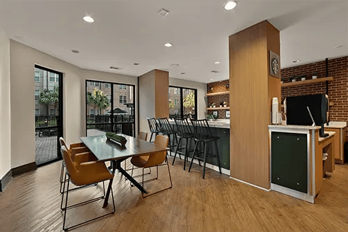 Dining table bar stools coffee station communal area at Station at Five Points in Columbia Student Accommodation