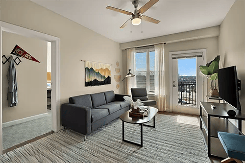 Sofa rug coffee table then living room at Station at Five Points in Columbia Student Accommodation