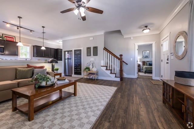 Sofa coffee table kitchen stairs bedroom Living room at The Cottages of College Station in College Station Student Accommodation