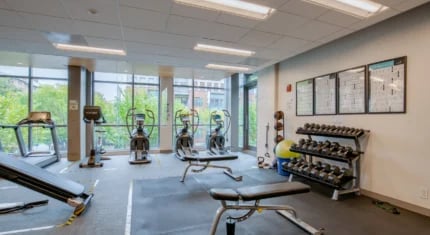 Gym equipment and weights Fitness facility at Nine East 33rd Apartments in Baltimore Student Accommodation