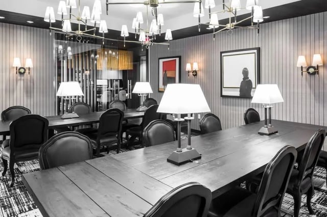 Long dark tables with chairs study area at The Holly in Lubbock Student Accommodation