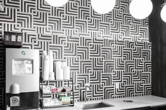 Coffee machine cups sink with geometric tile wall kitchen at The Holly in Lubbock Student Accommodation