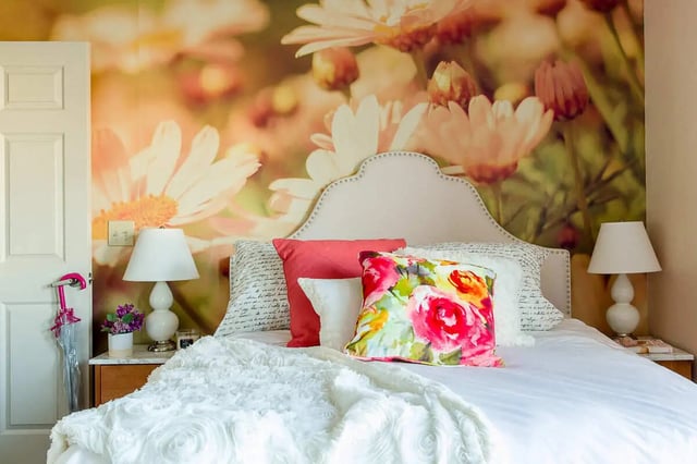 Bed with floral wallpaper white lamps bedroom at The Holly in Lubbock Student Accommodation