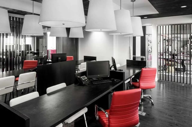 Desks computers chairs with modern lamps study area at The Holly in Lubbock Student Accommodation